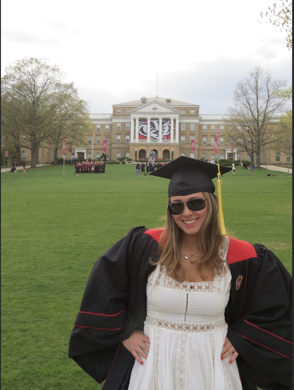 Juliet Mankin in cap and gown and sunglasses on Bascom Hill